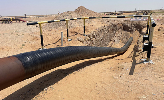 Completed pipeline in trench wrapped with a final layer of Denso Glass Outerwrap